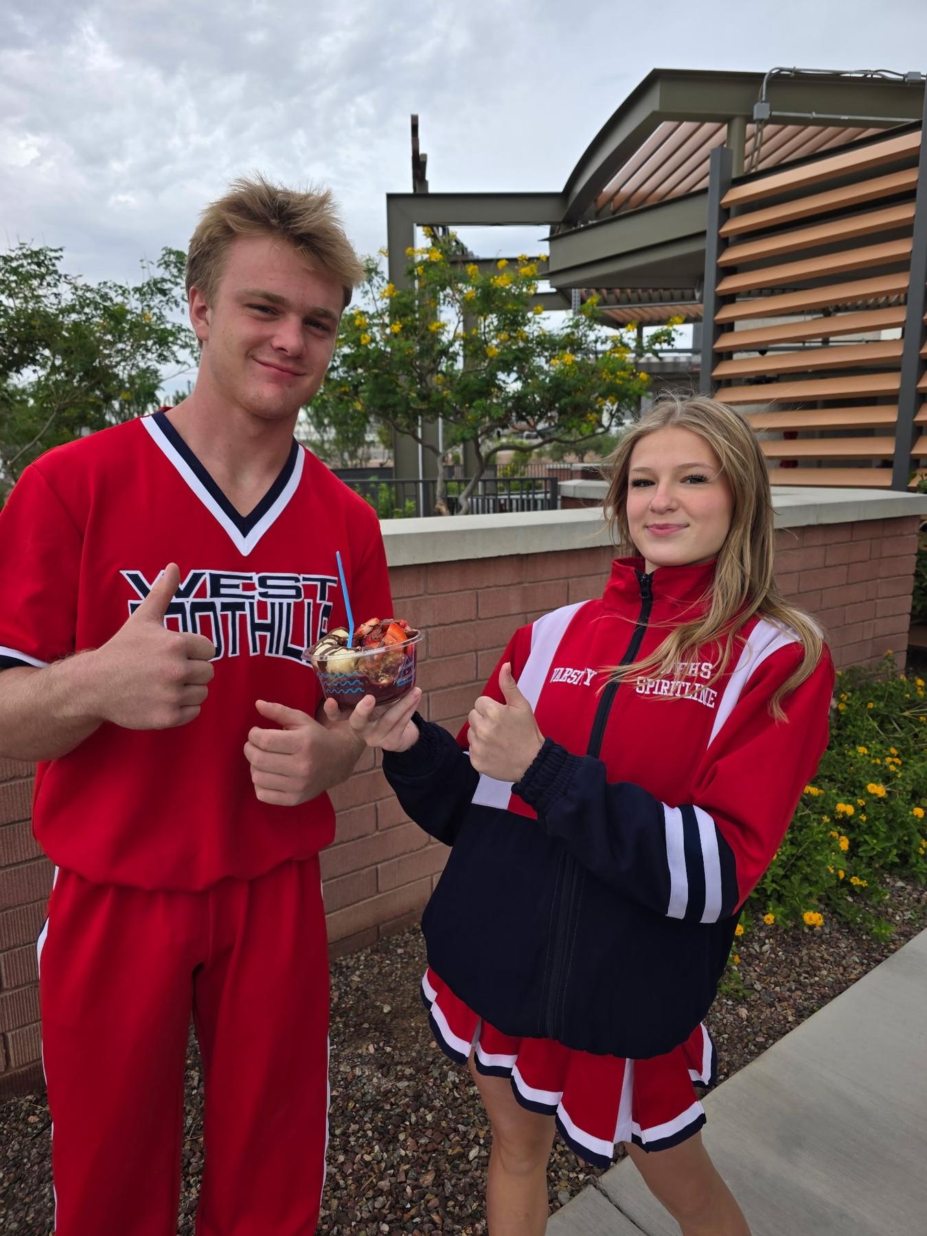 Two students with a bowl on fundraiser night